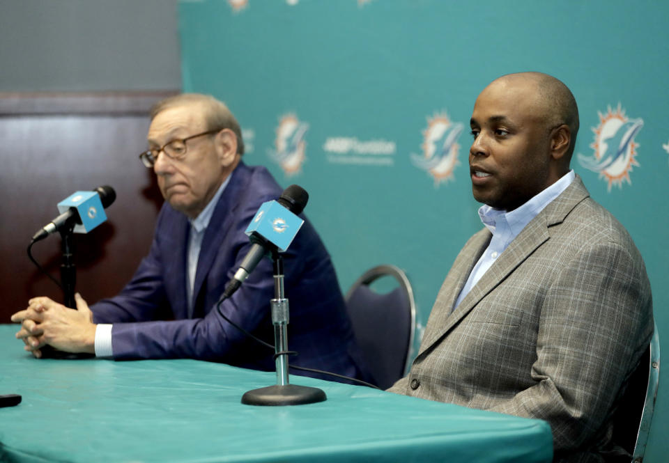 Miami Dolphins owner Stephen Ross, left, and general manager Chris Grier, right, speak during a news conference after head football coach Adam Gase was fired, Monday, Dec. 31, 2018, in Davie, Fla. (AP Photo/Lynne Sladky)