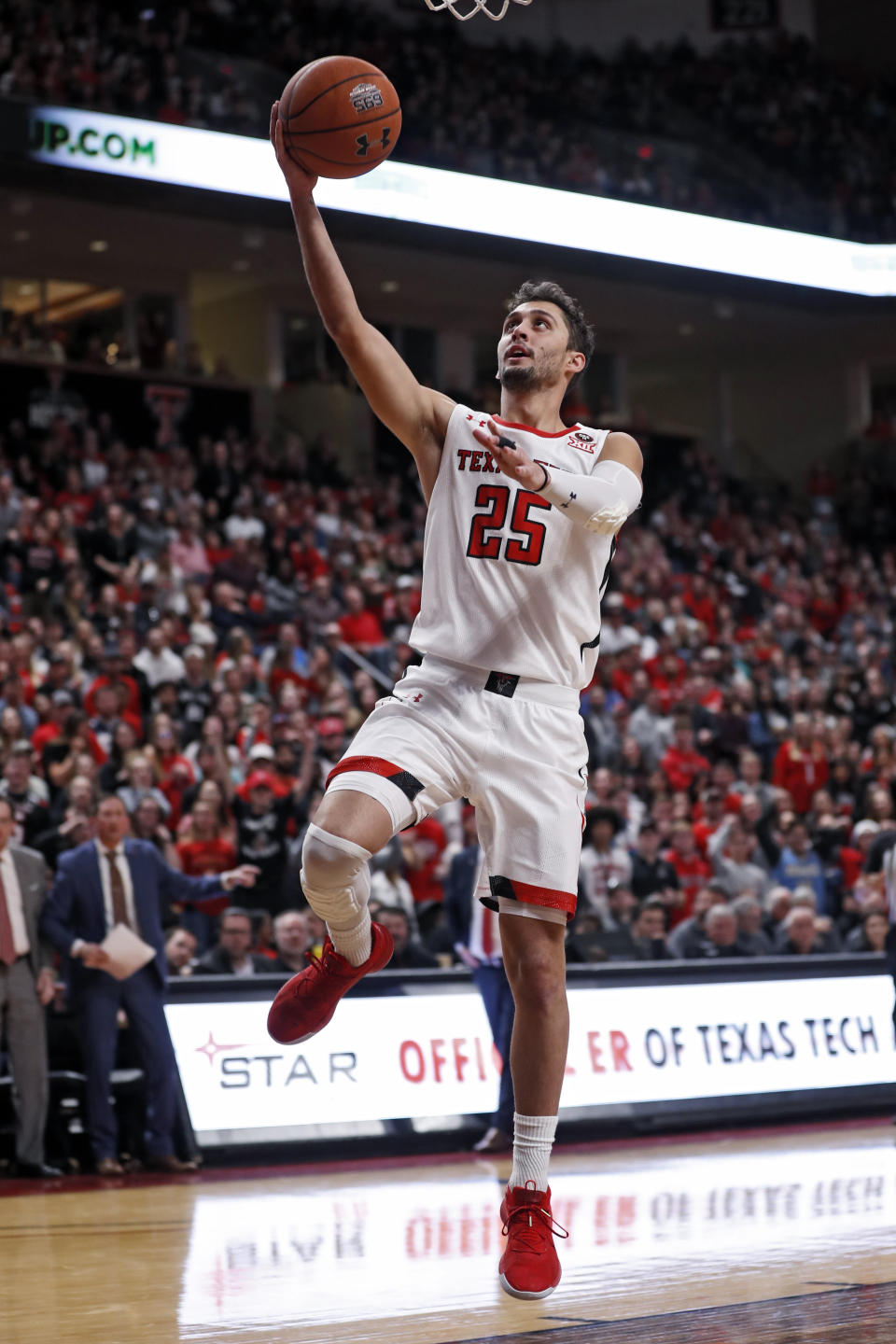 Texas Tech's Davide Moretti (25) breaks away to lay up the ball during the second half of an NCAA college basketball game against Iowa State, Saturday, Jan. 18, 2020, in Lubbock, Texas. (AP Photo/Brad Tollefson)