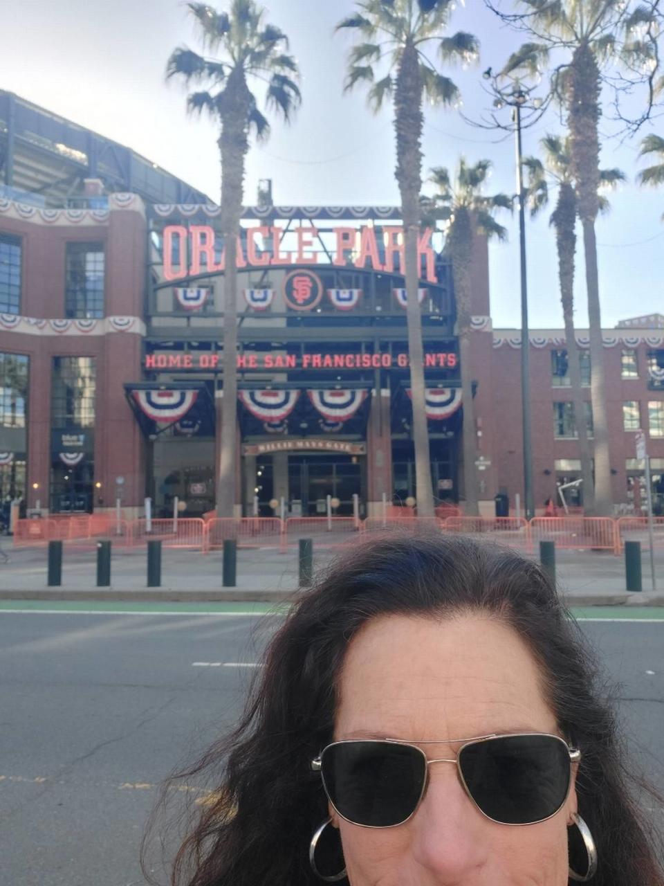 C.J. Silas took a selfie outside Oracle Park in San Francisco on Tuesday, March 26, 2024, after the Giants invited her to fill in as the public address announcer for the team’s last spring training game. It was her first time ever announcing a major league game, which has long been her dream job. Courtesy C.J. Silas