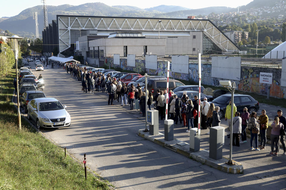 People wait in lines to get a vaccine in Sarajevo, Bosnia, Saturday, Sept. 25, 2021. Public mistrust of authorities in corruption-plagued Bosnia has created an opening for anti-vaccination movement even though the Balkan nation has the highest rate in Europe of coronavirus deaths and faces a growing number of new infections. So far, despite an abundance of coronavirus vaccines in Bosnia, just under 13 percent of its 3.3 million people had been fully immunized against Covid-19. (AP Photo)