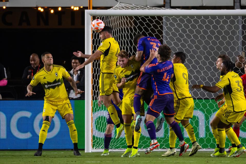 Crew defender Rudy Camacho heads away a Houston corner kick on Wednesday.