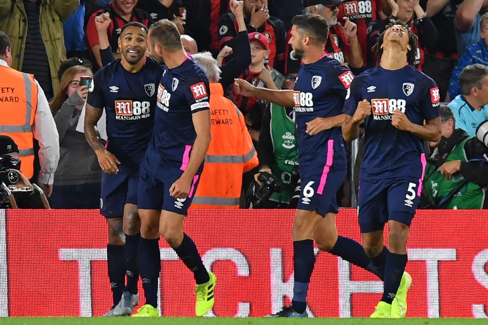 Bournemouth's English striker Callum Wilson (L) celebrates with teammates after scoring their late third goal during the English Premier League football match between Southampton and Bournemouth at St Mary's Stadium in Southampton, southern England on September 20, 2019. - Bournemouth won the game 3-1. (Photo by OLLY GREENWOOD / AFP) / RESTRICTED TO EDITORIAL USE. No use with unauthorized audio, video, data, fixture lists, club/league logos or 'live' services. Online in-match use limited to 120 images. An additional 40 images may be used in extra time. No video emulation. Social media in-match use limited to 120 images. An additional 40 images may be used in extra time. No use in betting publications, games or single club/league/player publications. /         (Photo credit should read OLLY GREENWOOD/AFP/Getty Images)