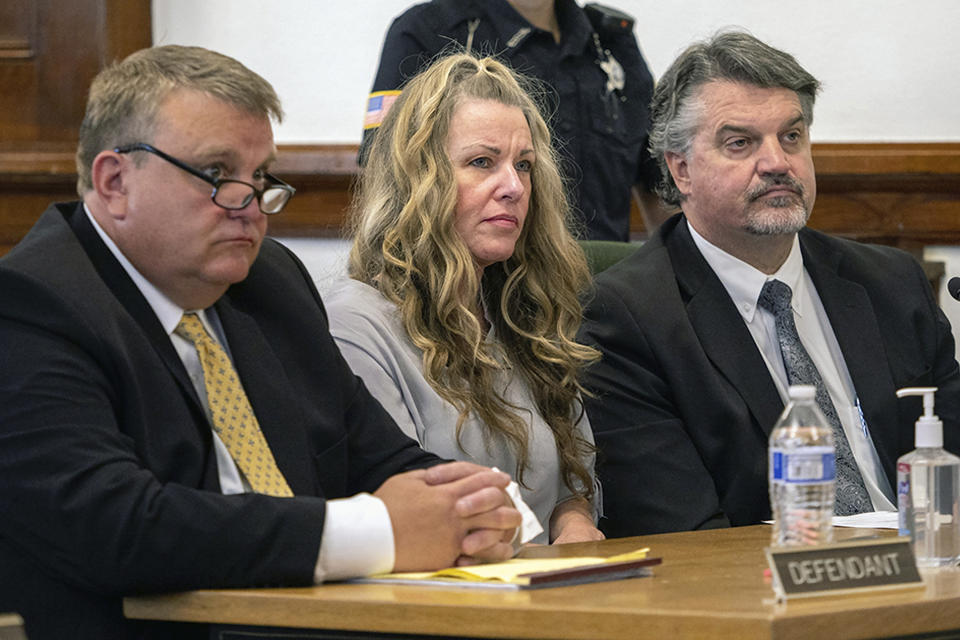FILE - Lori Vallow Daybell, center, sits between her attorneys for a hearing at the Fremont County Courthouse in St. Anthony, Idaho, on Aug. 16, 2022. An Idaho judge says a couple accused in a bizarre triple murder case will not be allowed to meet face-to-face to talk about strategy before they stand trial in April 2023. EastIdahoNews.com reports attorneys for Lori Vallow Daybell and Chad Daybell presented several requests to 7th District Judge Steven Boyce during a motion hearing on Thursday, Jan. 19, 2023. (Tony Blakeslee/East Idaho News via AP, Pool, File)