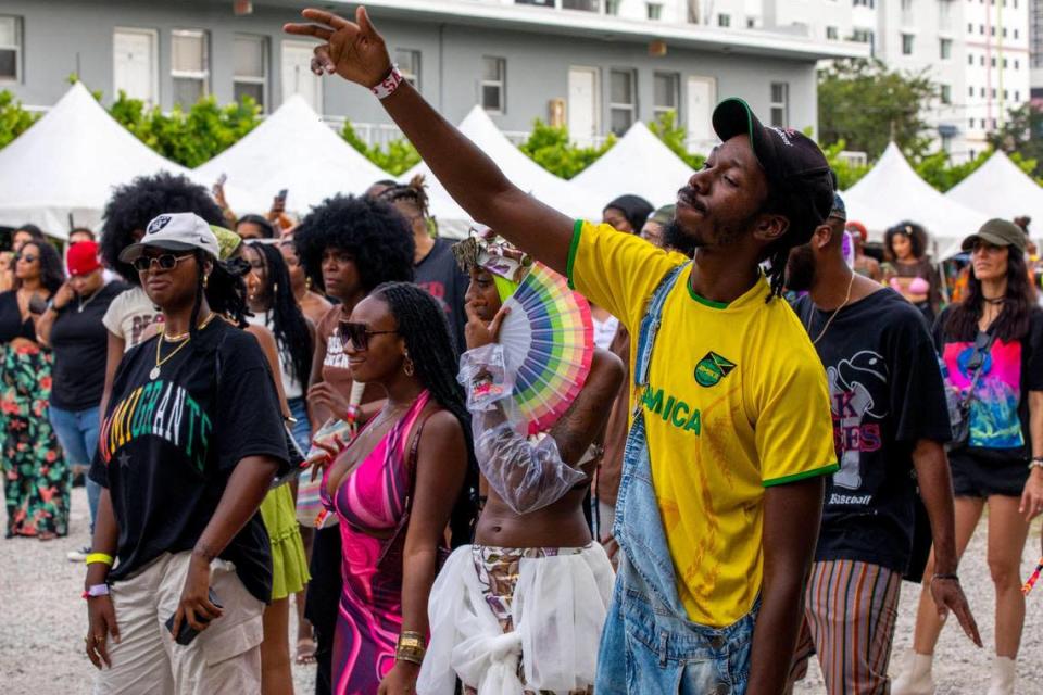 People dance to live music during AFROPUNK music festival at The Urban in the Historic Overtown neighborhood of Miami, Florida, on Saturday, May 21, 2022.