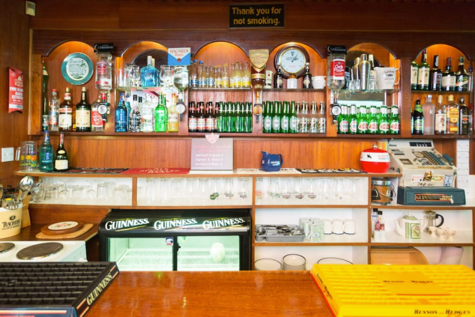 <p>The polished mahogany bar is equipped with pumps, optics and the original till. There’s also a fully stocked kitchen. It wouldn’t be a pub without games, and this bar has a darts board, a Skittles game (similar to bowling), as well as books, maps and other handy tourist information. (Airbnb) </p>