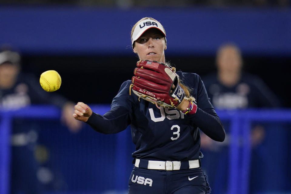 United States' Ally Carda throws out Japan's Haruka Agatsuma at first base during a softball game at the 2020 Summer Olympics, Tuesday, July 27, 2021, in Yokohama, Japan. (AP Photo/Sue Ogrocki)