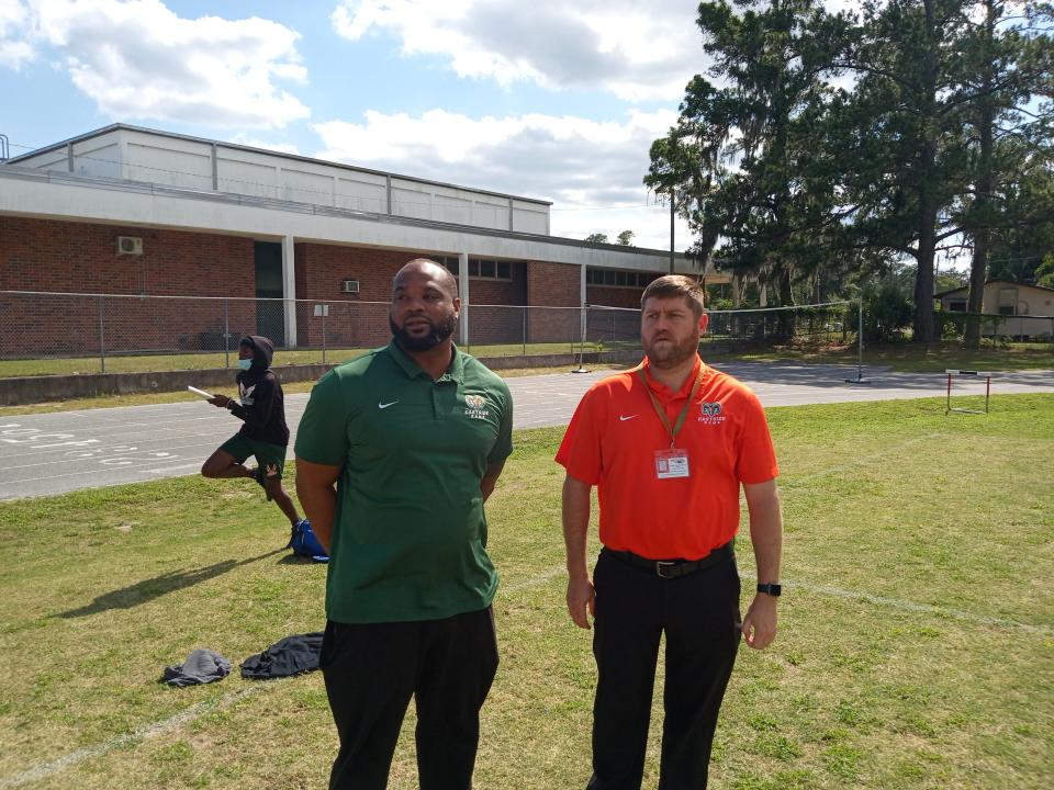 Harold "Gator" Hoskins, left, has been named the new head football coach at Eastside High School. Hoskins is pictured with Phillip Crutchfield, Eastside's athletic director, at an informal spring football practice on Monday.