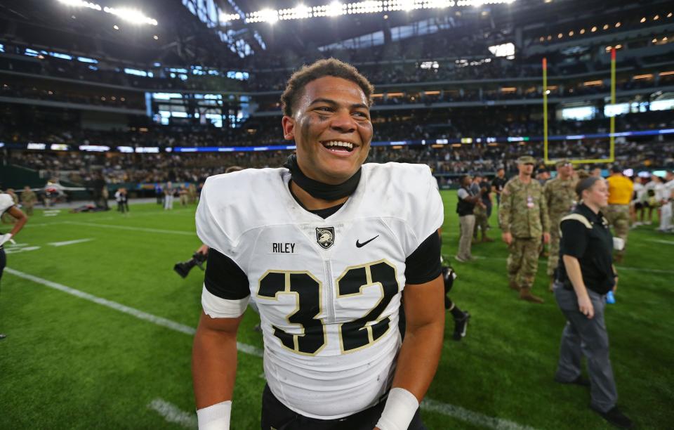 Army running back and Springfield Catholic grad Tyson Riley (32) celebrates after a win against the Air Force Falcons at Globe Life Park.