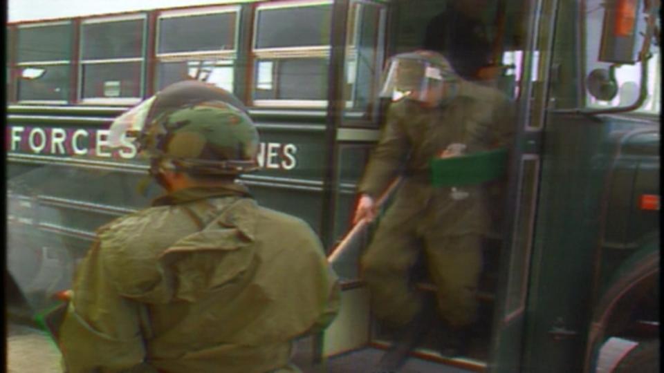 File footage of German military personnel getting off a bus carrying protective shields in Labrador in 2000.