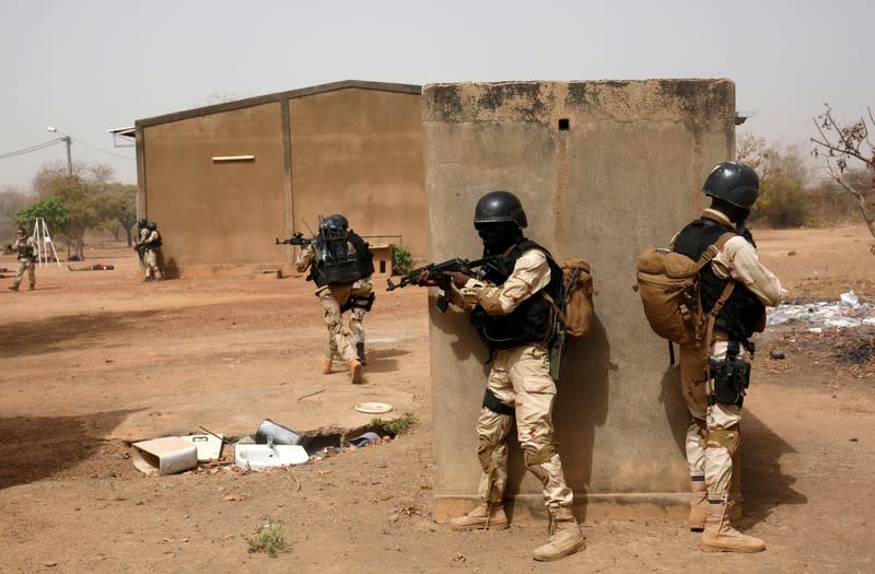 Soldiers from Burkina Faso participate in a simulated raid during the U.S. sponsored Flintlock exercises in Ouagadougou, Burkina Faso