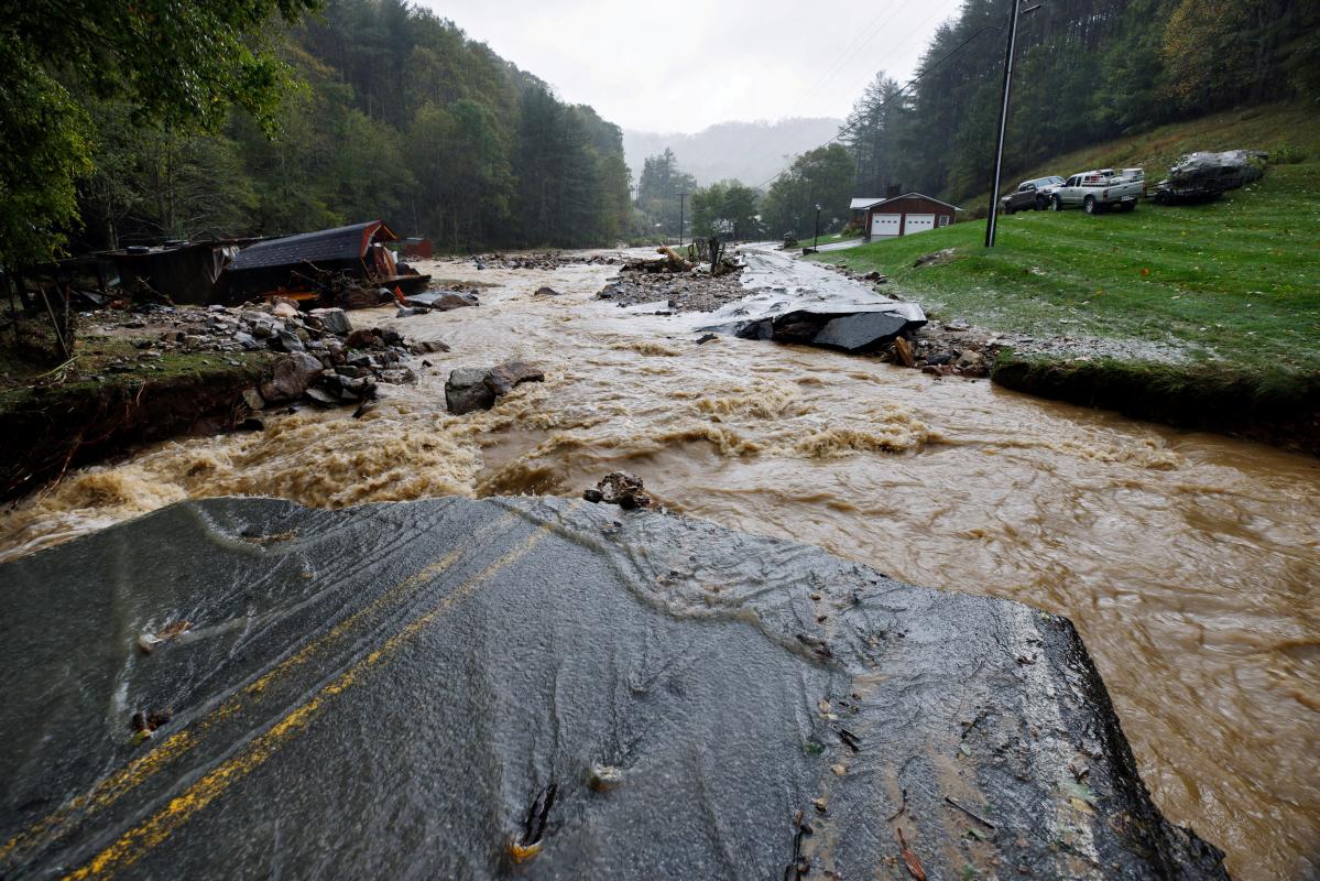 View photos and videos of flooding in Asheville in western North Carolina after Helene