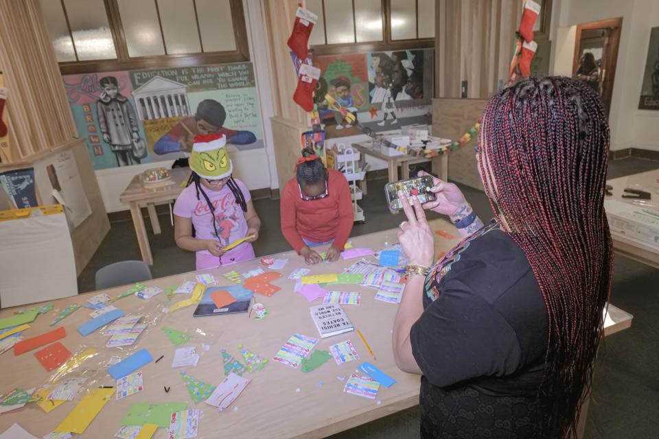 Nikole Hannah-Jones (right) takes photos of students at the 1619 Freedom School.