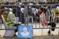 People wait for Pope Francis arrival at John Garang Mausoleum on the occasion of a mass in Juba, South Sudan, Sunday, Feb. 5, 2023. Francis is in South Sudan on the second leg of a six-day trip that started in Congo, hoping to bring comfort and encouragement to two countries that have been riven by poverty, conflicts and what he calls a "colonialist mentality" that has exploited Africa for centuries. (AP Photo/Gregorio Borgia)