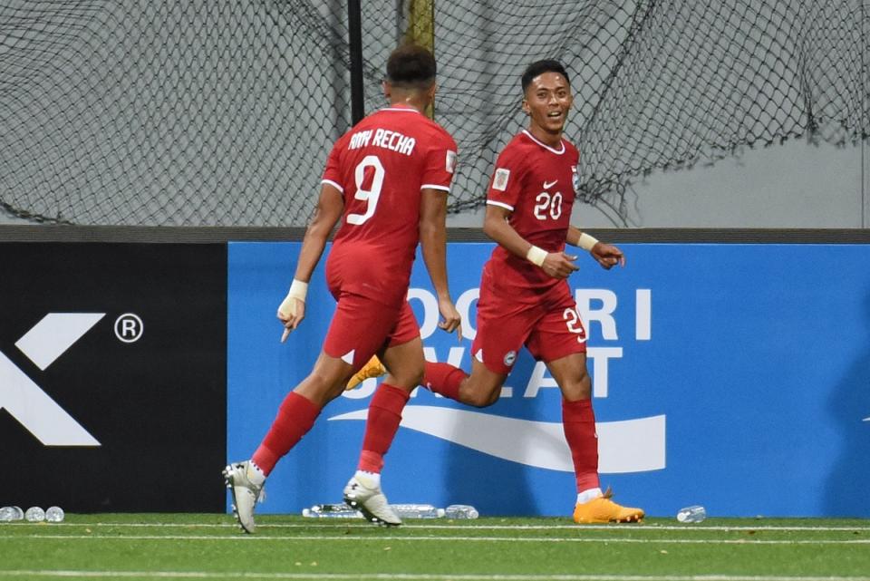 Singapore forward Shawal Anuar (jersey No.20) celebrates his goal with Amy Recha in their AFF Mitsubishi Electric Cup tie against Myanmar at the Jalan Besar Stadium. (PHOTO: FAS)