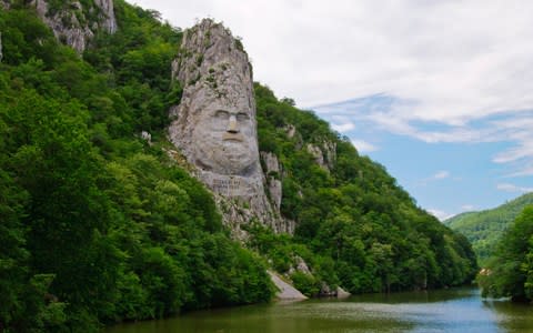 The face of the last king of Dacia carved in a cliff face - Credit: iStock