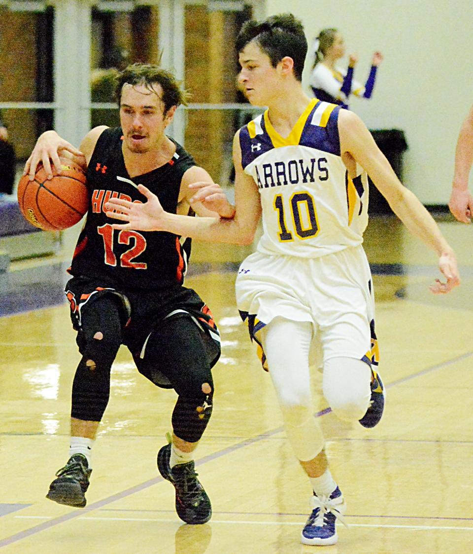 Watertown's Reese Stark (10) defends against Huron's Cade McNeil during during their Eastern South Dakota Conference boys basketball game Tuesday night in the Civic Arena. Watertown won 59-44.