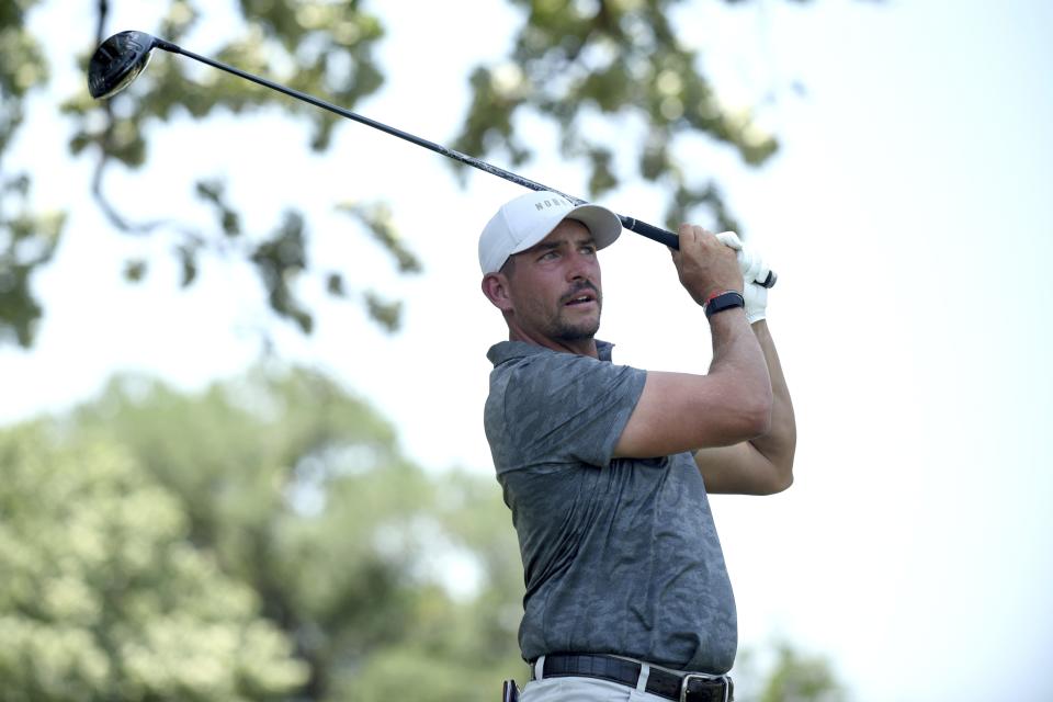 Scott Stallings watches his tee shot on the third hole during the third round of the Charles Schwab Challenge golf tournament at the Colonial Country Club, Saturday, May 28, 2022, in Fort Worth, Texas. (AP Photo/Emil Lippe)