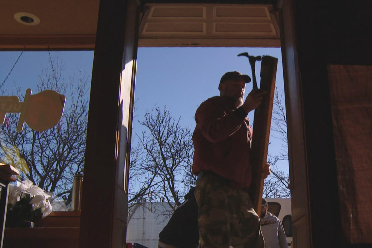 A volunteer works outside BAR:PM. (KSDK)