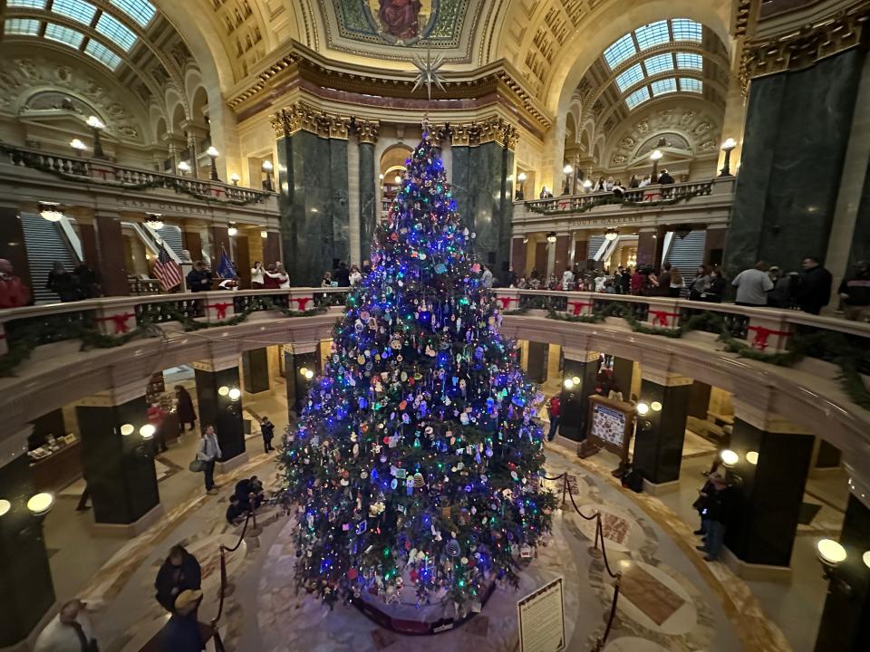 The Capitol Holiday Tree that stands in the statehouse rotunda is illuminated by more than 2000 light. The 32-foot, Balsam Fir, donated by Marge Van Heuklon of Rhinelander, the tree's theme commemorates the state's 175-year anniversary.