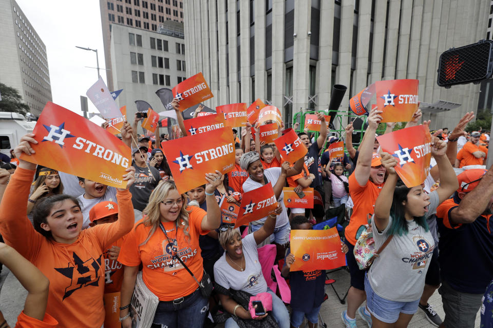 Houston Astros fans celebrate before a parade honoring the World Series baseball champions. (AP)