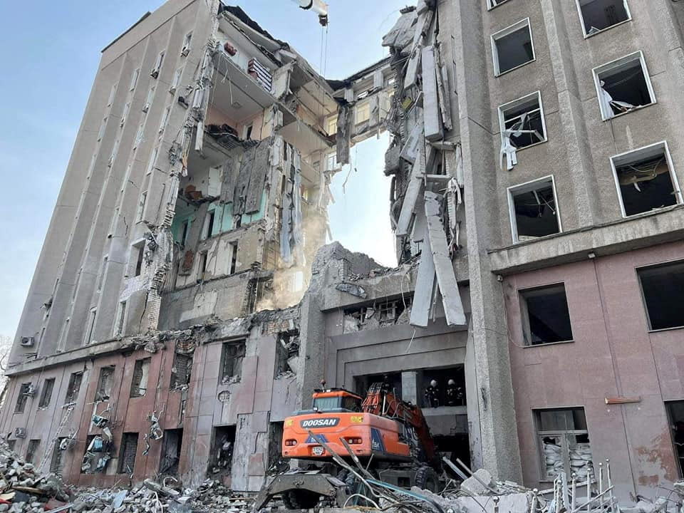 Rescuers work at the regional administration building, which was hit by cruise missiles, amid Russia's invasion of Ukraine in Mykolaiv, Ukraine, in a handout picture released March 30, 2022 by the State Emergency Service of Ukraine. / Credit: STATE EMERGENCY SERVICE//Handout/REUTERS