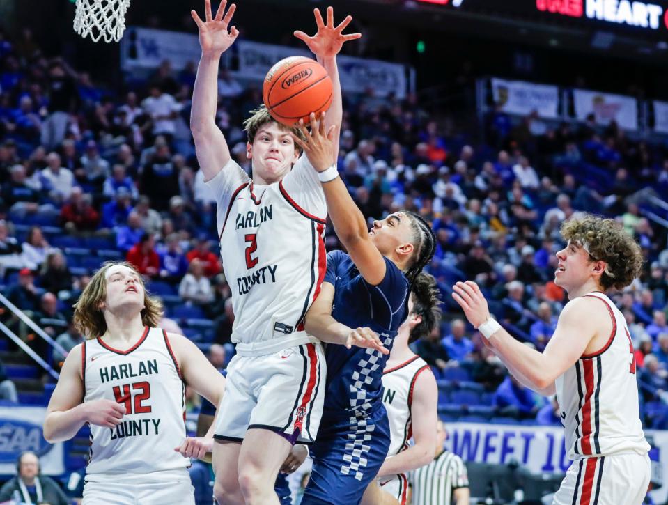 Harlan County's Trent Noah (2) defends as Warren Central's Kade Unseld (4) tries to score in the second half Thursday of the 2024 UK Healthcare KHSAA Boys' Sweet 16 in Lexington. March 21, 2024