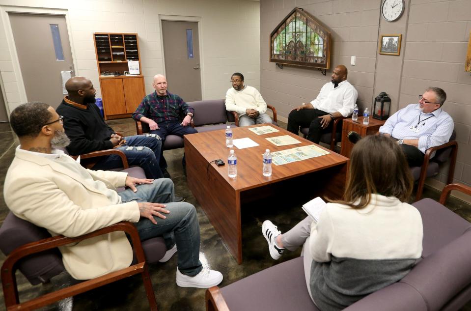 Several residents and the warden at the South Bend Community Re-Entry Center talk Monday, March 20, 2023, about the residents’ efforts to raise money for local low-income children so they can attend an upcoming South Bend Symphony Orchestra concert.