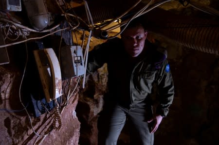 FILE PHOTO: Israeli Army Spokesperson, Lieutenant-Colonel Jonathan Conricus looks on during a media tour organised by the Israeli military inside a cross-border tunnel which Israel said was dug from Lebanon into Israel, near Zar'it in northern Israel