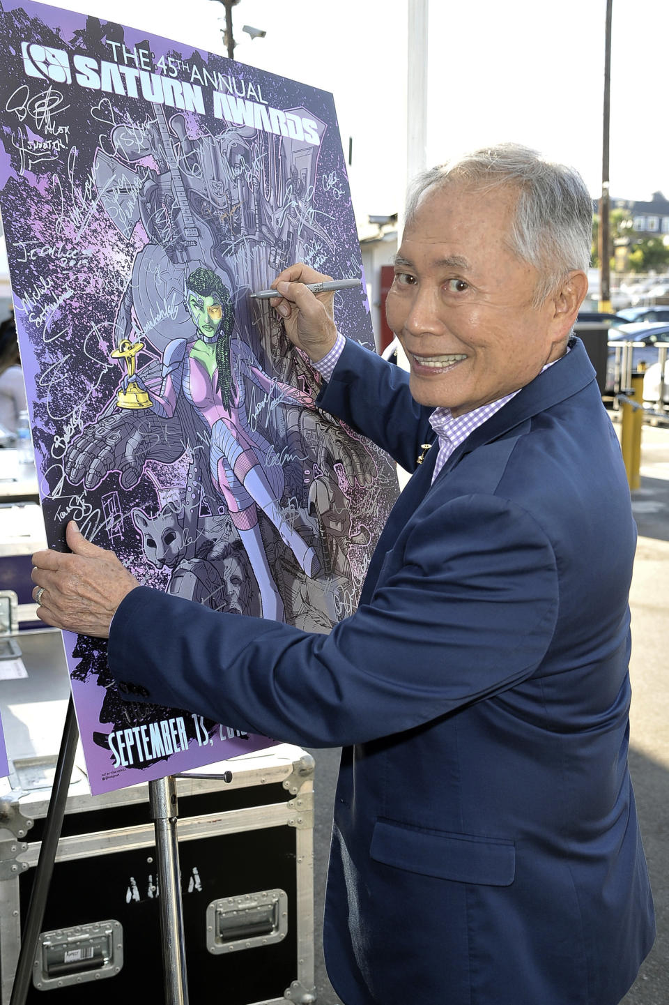 George Takei signs a poster for the 45th Annual Saturn Awards at the Avalon Hollywood on Friday, Sept. 13, 2019, in Los Angeles. (Photo by Richard Shotwell/Invision/AP