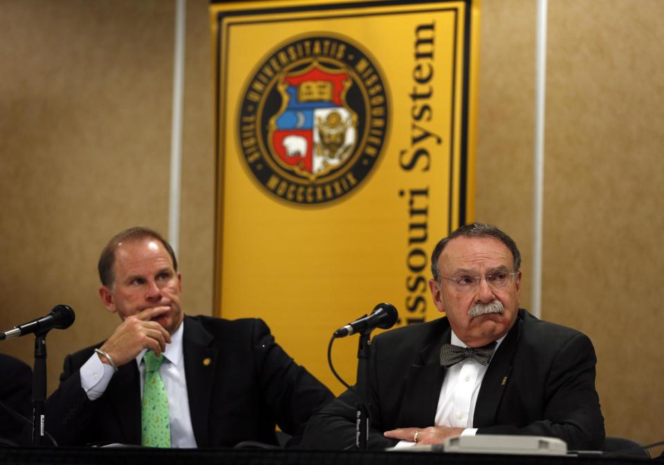 University of Missouri President Tim Wolfe, left, and University of Missouri Chancellor R. Bowen Loftin participate in a news conference Friday, April 11, 2014, in Rolla, Mo. The news conference was held to discuss an outside legal review of the university's response to a case involving school swimmer Sasha Menu Courey, who killed herself 16 months after an alleged off-campus rape by as many as three football players in February 2010. (AP Photo/Jeff Roberson)