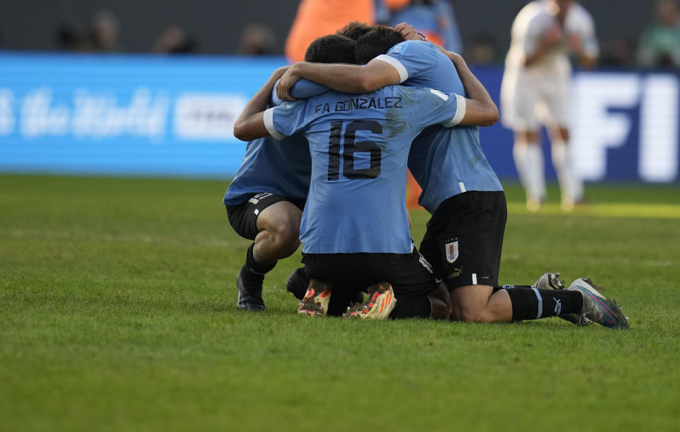 Players of Uruguay celebrate their team's win over Israel at the end of a FIFA U-20 World Cup semifinal soccer match at the Diego Maradona stadium in La Plata, Argentina, Thursday, June 8, 2023. (AP Photo/Ricardo Mazalan)