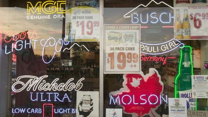 Neon signs in a Connecticut liquor store window.