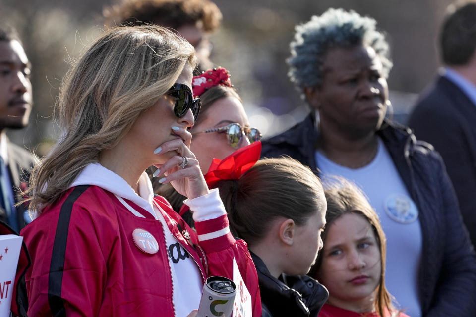 Covenant School mother Mary Joyce, left, attends the Linking Arms for Change human chain Wednesday, March 27, 2024, in Nashville, Tenn. The event was to commemorate the one-year anniversary of the mass shooting at the school. Three students and three adults were killed in the incident. (AP Photo/George Walker IV)