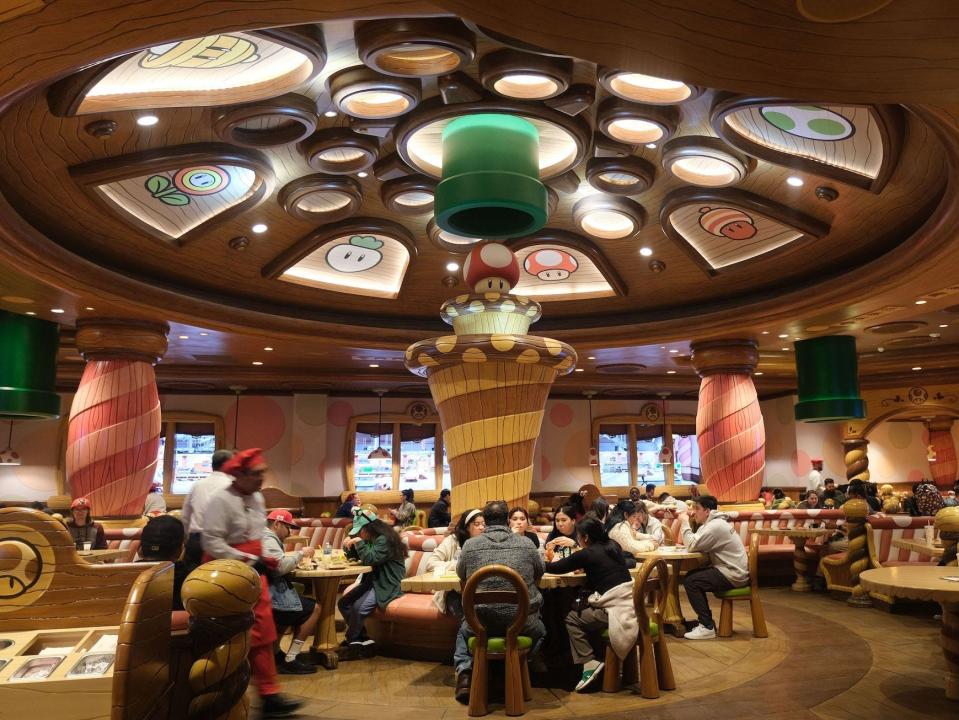 Guests eat lunch at the Toadstool Cafe during a preview of Super Nintendo World at Universal Studios in Los Angeles, California, on January 13, 2023.