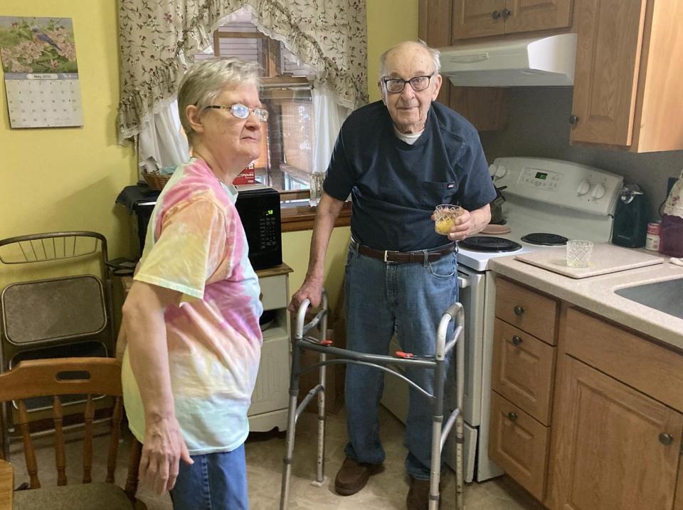 Florian "Larry" Ozimek, who will be 105 on May 28, has a glass of microwaved orange juice with his 80-year-old daughter, Joan Ozimek, on May 15. The two live together in their west Erie home.