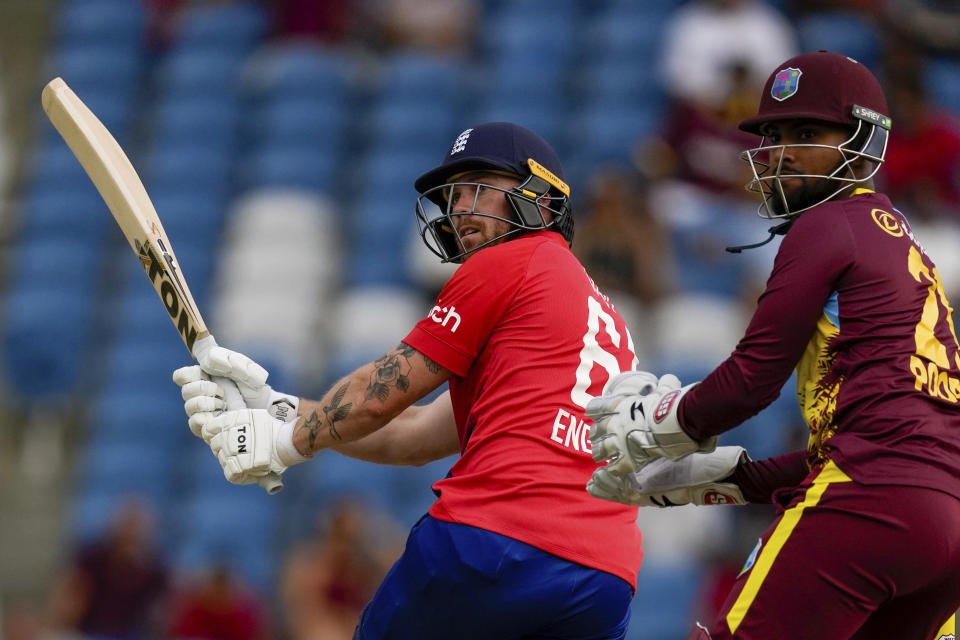 England's Phil Salt plays a shot for four runs against West Indies during the fourth T20 cricket match at Brian Lara Stadium in Tarouba, Trinidad and Tobago, Tuesday, Dec. 19, 2023. (AP Photo/Ricardo Mazalan)