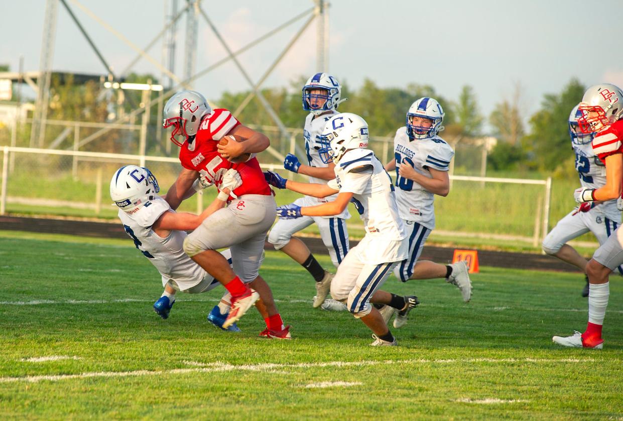 Buckeye Central's Manny Mullins powers his way toward the endzone.