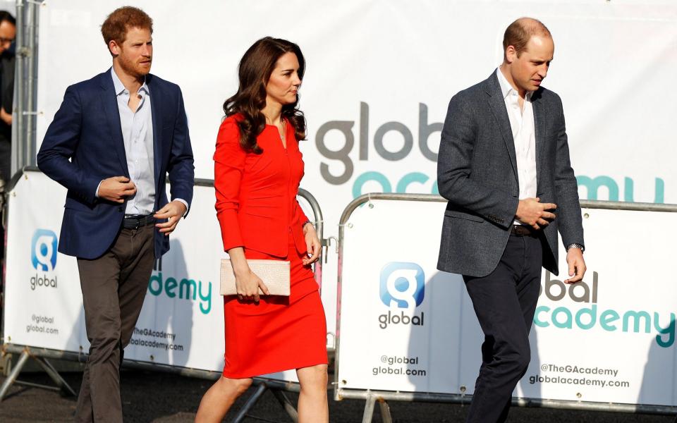 Prince William, Prince Harry and Catherine, the Duchess of Cambridge, arrive to open the Global Academy - Credit:  REUTERS