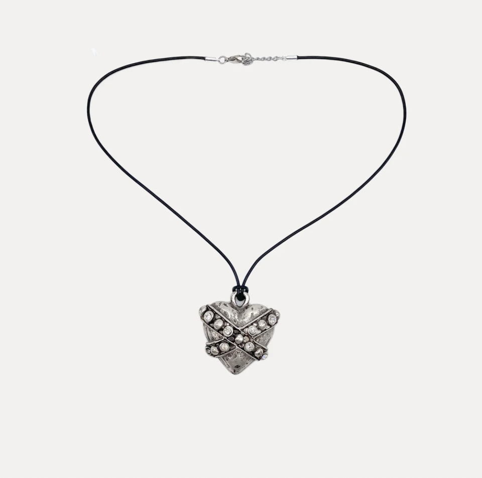 <p><a href="https://www.streetsaheadinc.com/products/broken-hearted-pendant-necklace?variant=40342300524611" rel="nofollow noopener" target="_blank" data-ylk="slk:Shop Now;elm:context_link;itc:0;sec:content-canvas" class="link ">Shop Now</a></p><p>Broken Hearted</p><p>$89.00</p><p>streetsaheadinc.com</p>