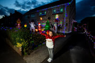 A mum has gone all out to cheer up her kids and neighbours by putting up her CHRISTMAS decorations three months early - including 3,000 outdoor lights. Caroline Gabe, 46, has been shielding with her children since March - and said putting up her tree and decorations in September was a much-needed boost. She has spent the year buying outdoor lights and installations - from as far away as America - and put them all up last week, on a whim. Almost all of them are outside - including 3,000 fairy lights, sparkling snow, an 8ft inflatable snowman, as well as Santa and his reindeer.