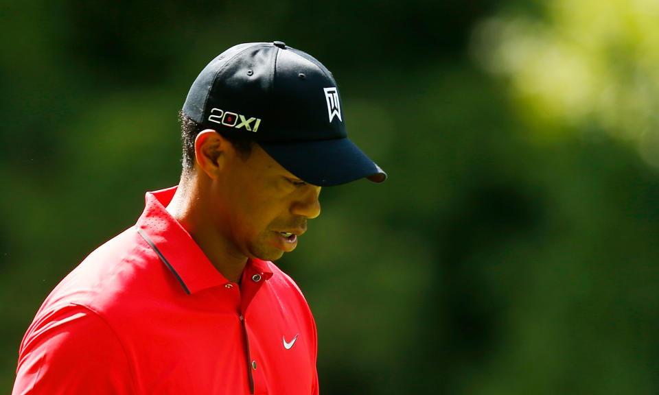 CARMEL, IN - SEPTEMBER 09: Tiger Woods reacts to his approach shot on the first hole during the final round of the BMW Championship at Crooked Stick Golf Club on September 9, 2012 in Carmel, Indiana. (Photo by Scott Halleran/Getty Images)