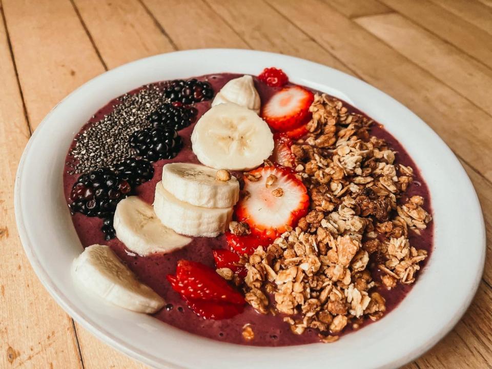 smoothie bowl with chia seeds, blackberries, banana, strawberries, and granola