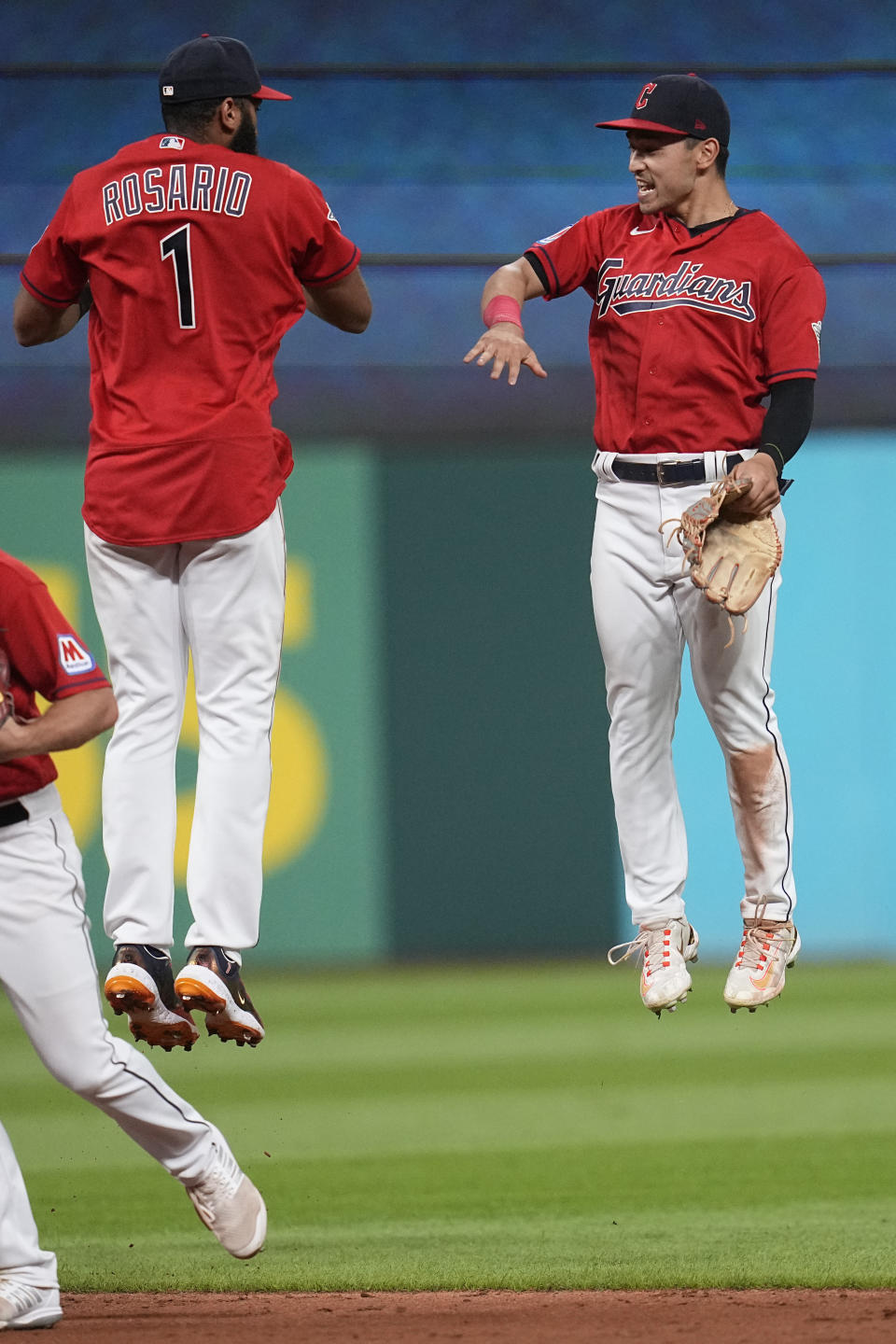 Cleveland Guardians shortstop Amed Rosario (1) and Steven Kwan, right, celebrate after they defeated the Philadelphia Phillies in a baseball game Friday, July 21, 2023, in Cleveland. (AP Photo/Sue Ogrocki)