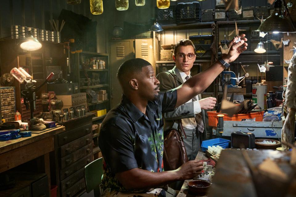 Jamie Foxx (left, with Dave Franco) plays a blue-collar dad whose San Fernando Valley pool-cleaning service is a front for his real business, hunting and killing vampires, in the horror action comedy "Day Shift."