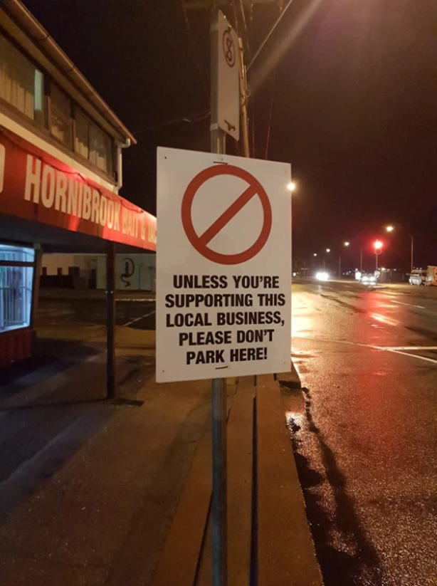 The sign outside the Hornibrook Bait and Tackle store in Clontarf says only people shopping at the store can park there. Source: Facebook