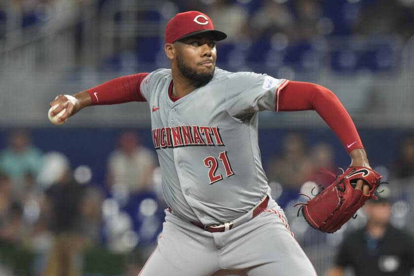 Cincinnati Reds pitcher Hunter Greene (21) aims a pitch during the first inning of a baseball game against the Miami Marlins, Thursday, Aug. 8, 2024, in Miami. (AP Photo/Marta Lavandier)