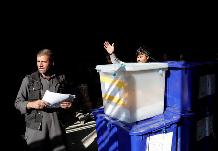 Afghan election commission workers prepare to send ballot boxes and election material to the polling stations at a warehouse in Kabul, Afghanistan October 18, 2018.REUTERS/Mohammad Ismail