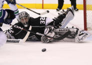 LOS ANGELES, CA - APRIL 15: Goalie Jonathan Quick #32 of the Los Angeles Kings watches the puck after making a save with his foot against the Vancouver Canucks in Game Three of the Western Conference Quarterfinals during the 2012 NHL Stanley Cup Playoffs at Staples Center on April 15, 2012 in Los Angeles, California. (Photo by Stephen Dunn/Getty Images)