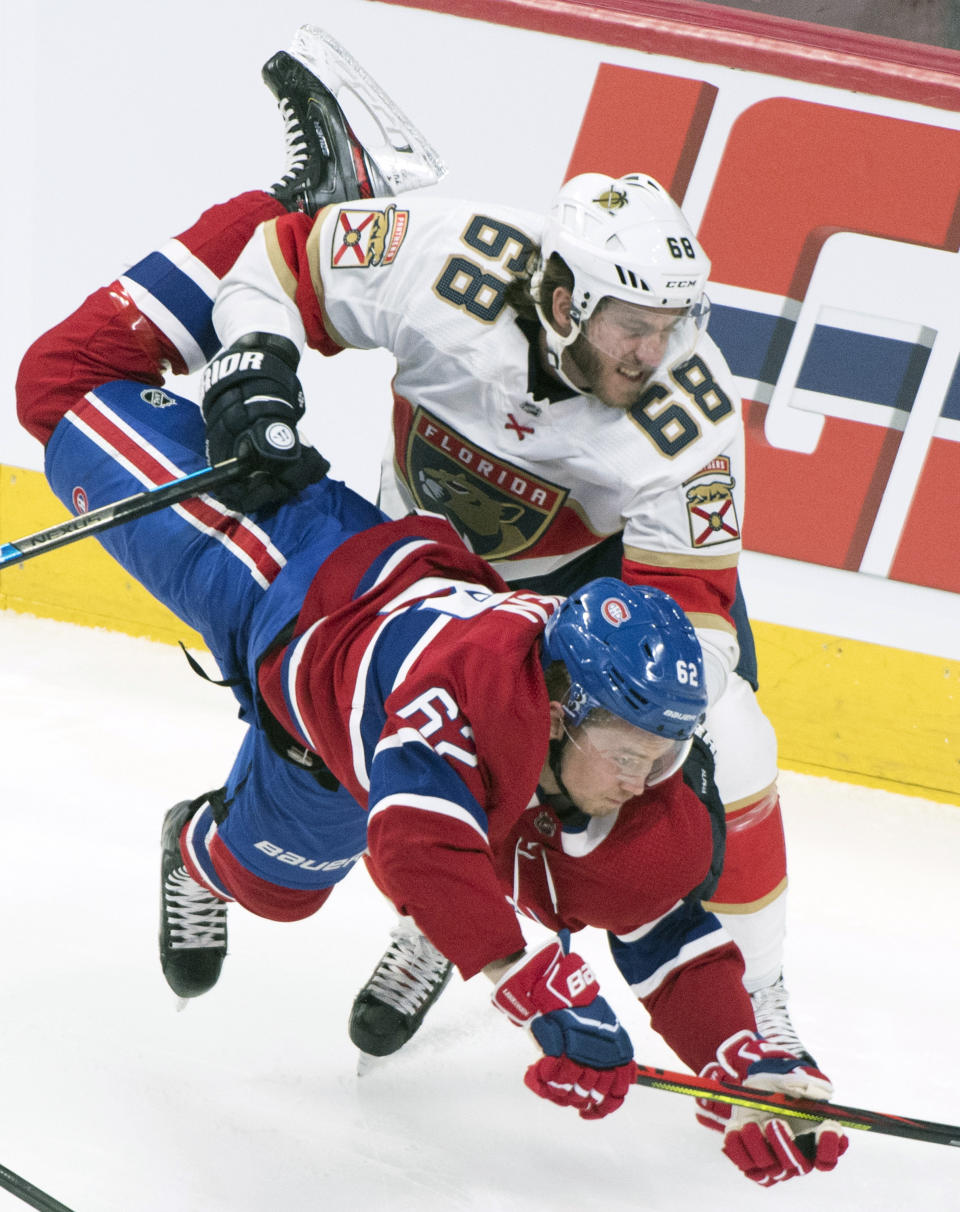 Florida Panthers' Mike Hoffman (68) upends Montreal Canadiens' Artturi Lehkonen during the second period of an NHL hockey game, Saturday, Feb. 1, 2020 in Montreal. (Graham Hughes/The Canadian Press via AP)