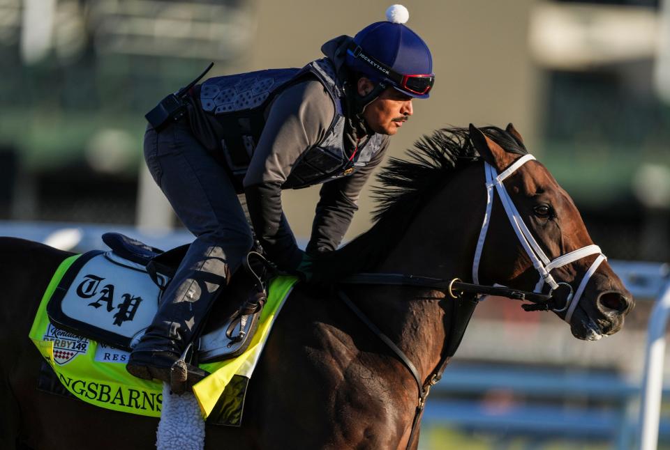 Kentucky Derby contender Kingsbarns with exercise rider Elder Flores aboard work at Churchill Downs Wednesday morning May 3, 2023, in Louisville, Ky. The horse is trained by Todd Pletcher.